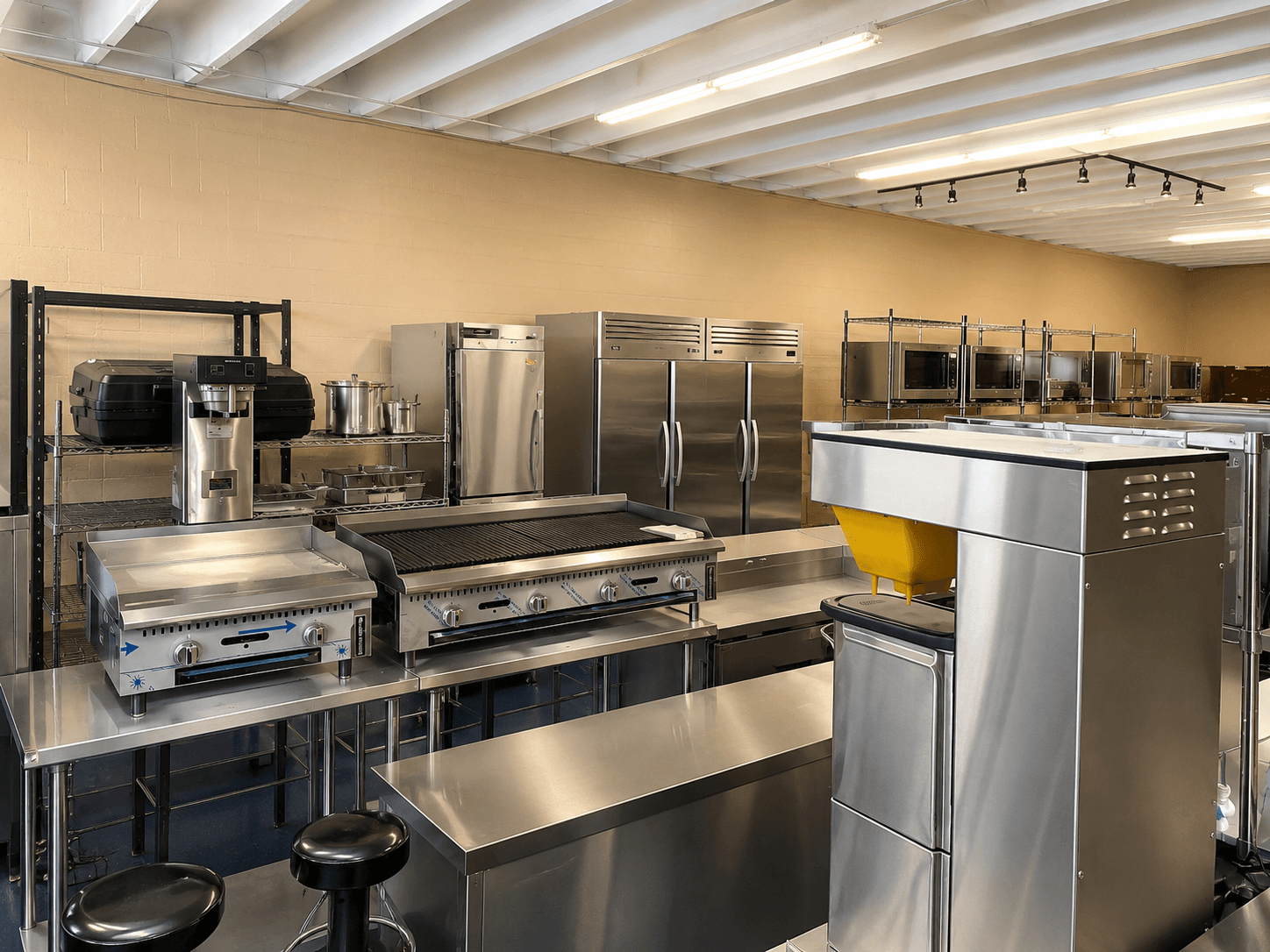ProShore Liquidators Egg Harbor showroom with commercial kitchen equipment — restaurant ovens, refrigeration, and prep stations in South Jersey
